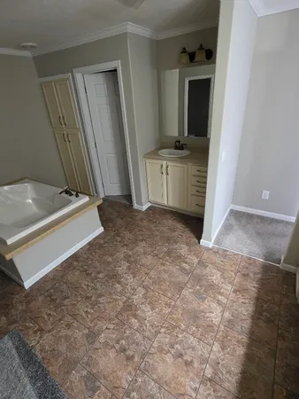 a view of a kitchen with a sink cabinets and a window