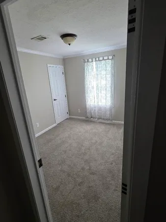 a view of room with window and hardwood floor