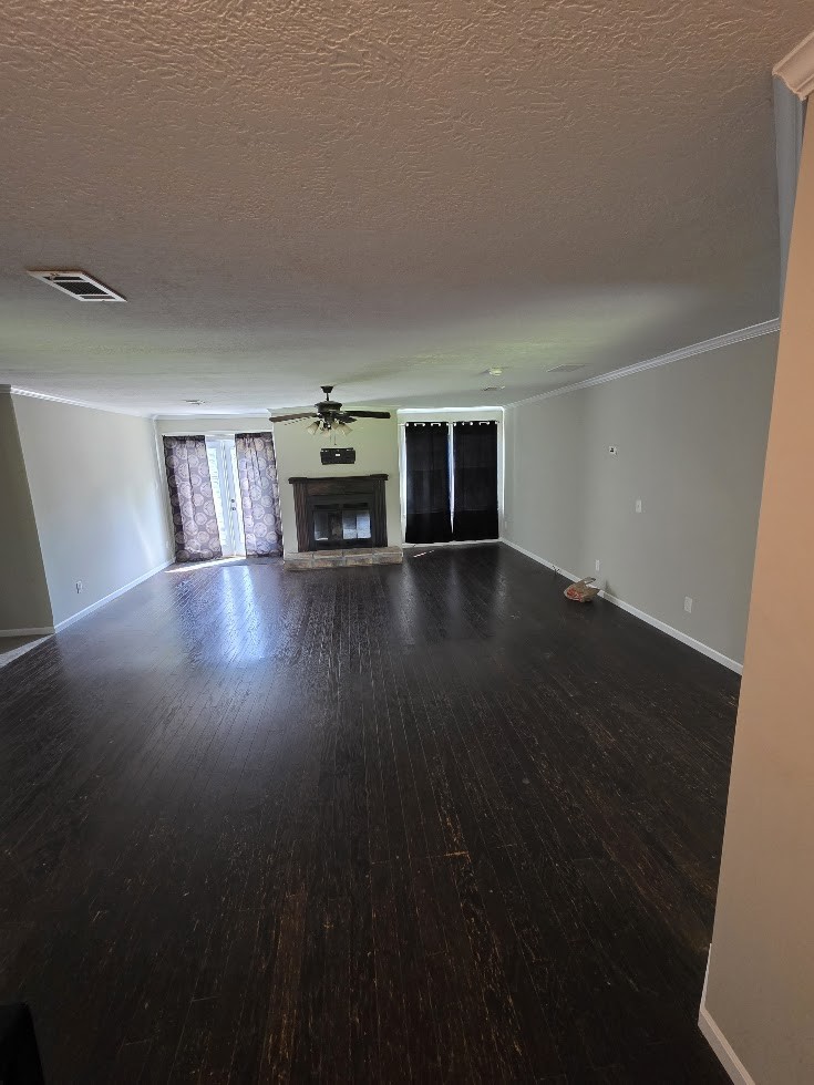 2004 Luther Sharp Road Columbia, TN 38401 - Photo 2 of 18 a view of empty room with wooden floor and fireplace