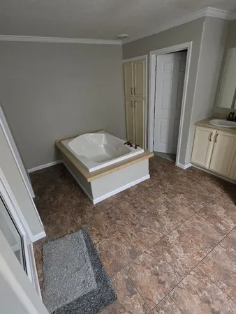 a view of a livingroom with an empty space and a sink