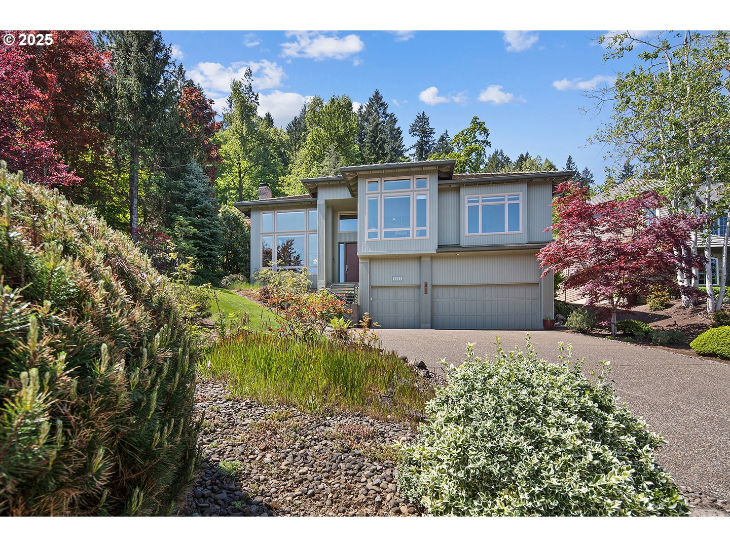 17514 Brookhurst Drive Lake Oswego, OR 97034 - Photo 1 of 37 a front view of a house with a yard and garage
