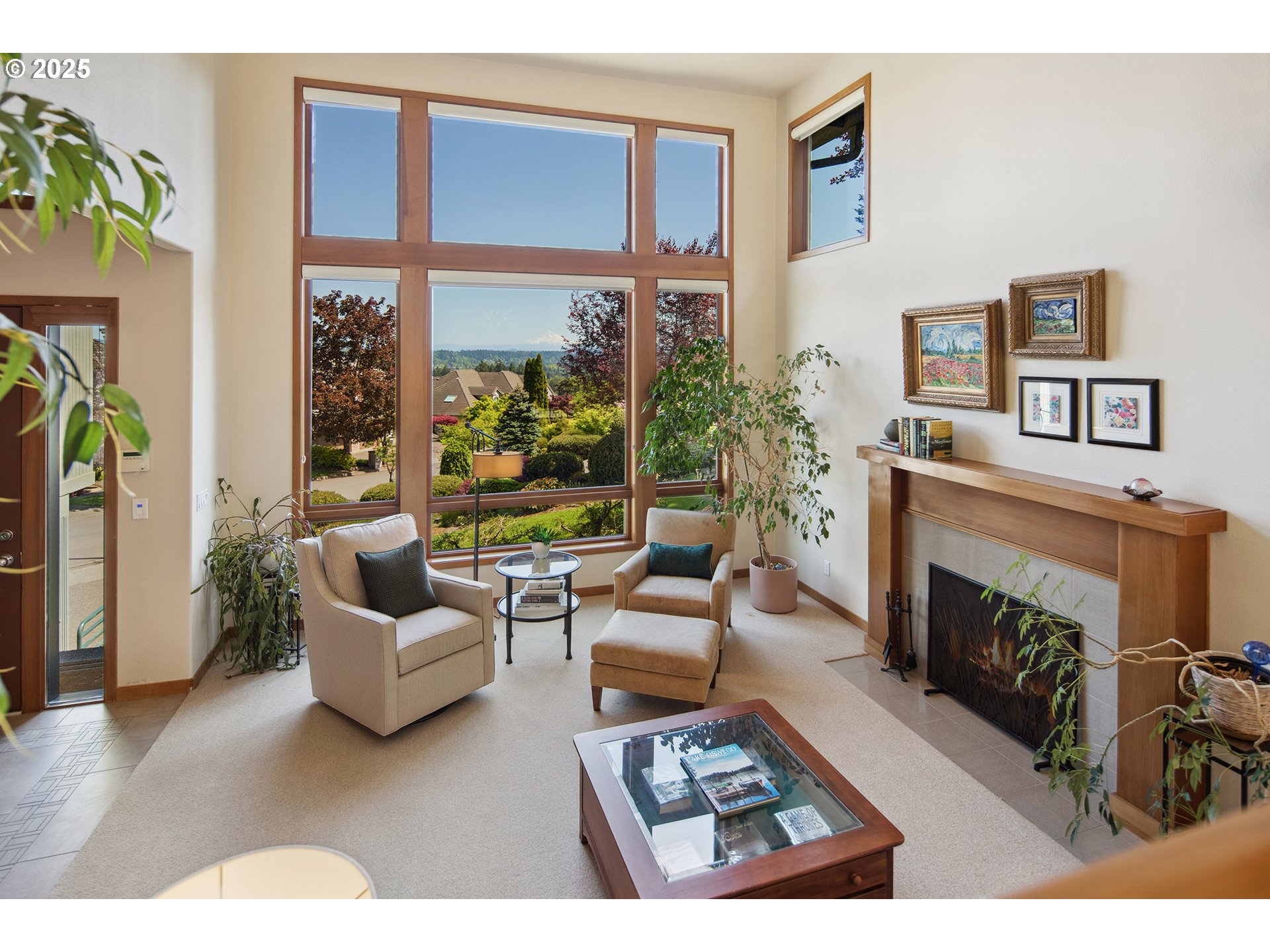 17514 Brookhurst Drive Lake Oswego, OR 97034 - Photo 2 of 37 a living room with furniture large window and a fireplace