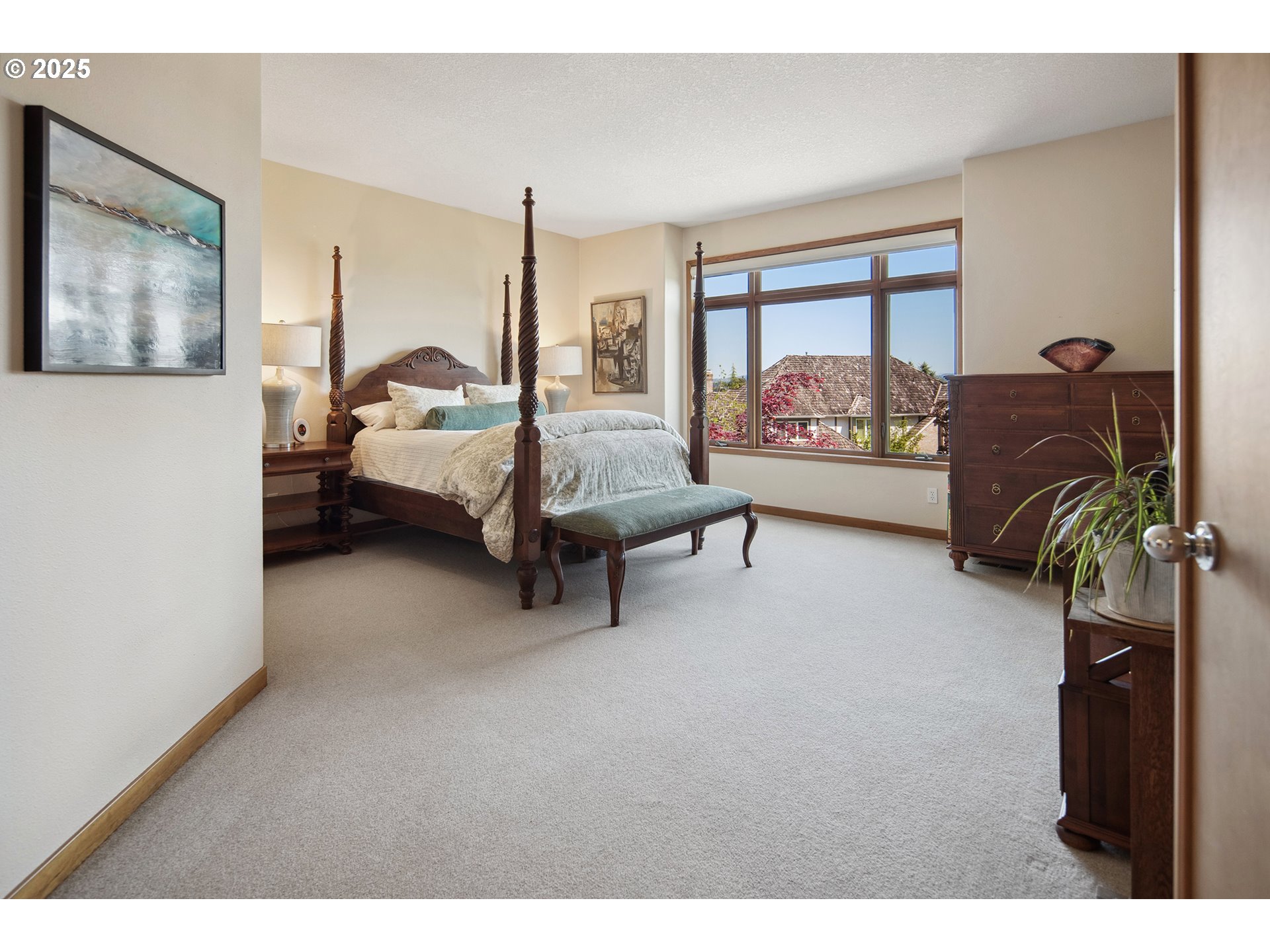 17514 Brookhurst Drive Lake Oswego, OR 97034 - Photo 22 of 37 a bedroom with furniture and a large window