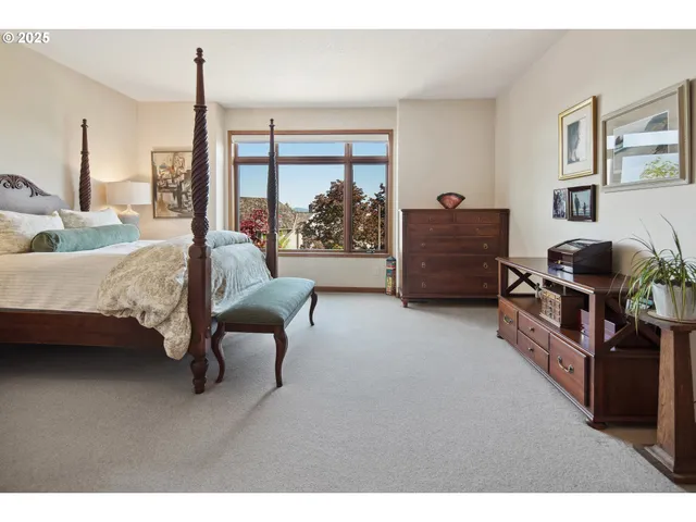 a bedroom with furniture and a window