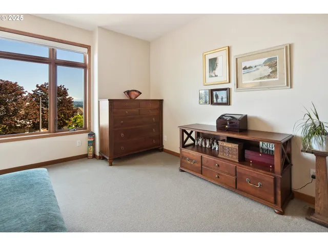 a bedroom with furniture and a window