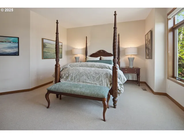 a bedroom with furniture and a window