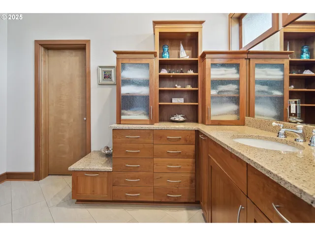 a kitchen with cabinets and window