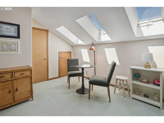 a living room with furniture and a ceiling fan