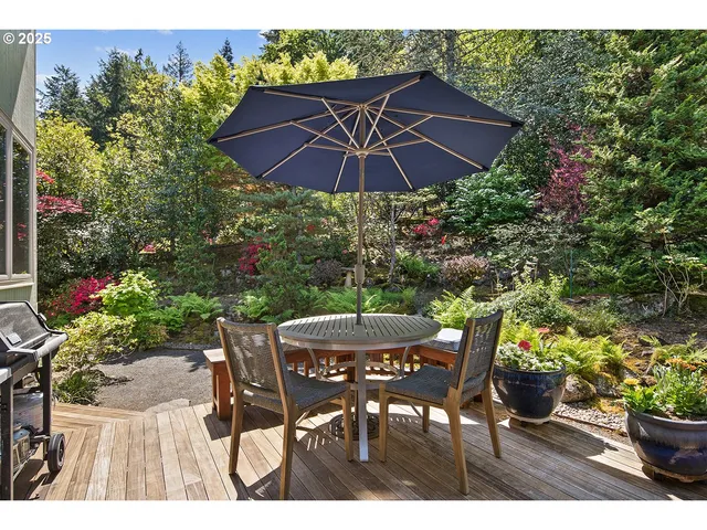 a view of a chairs and table in a patio
