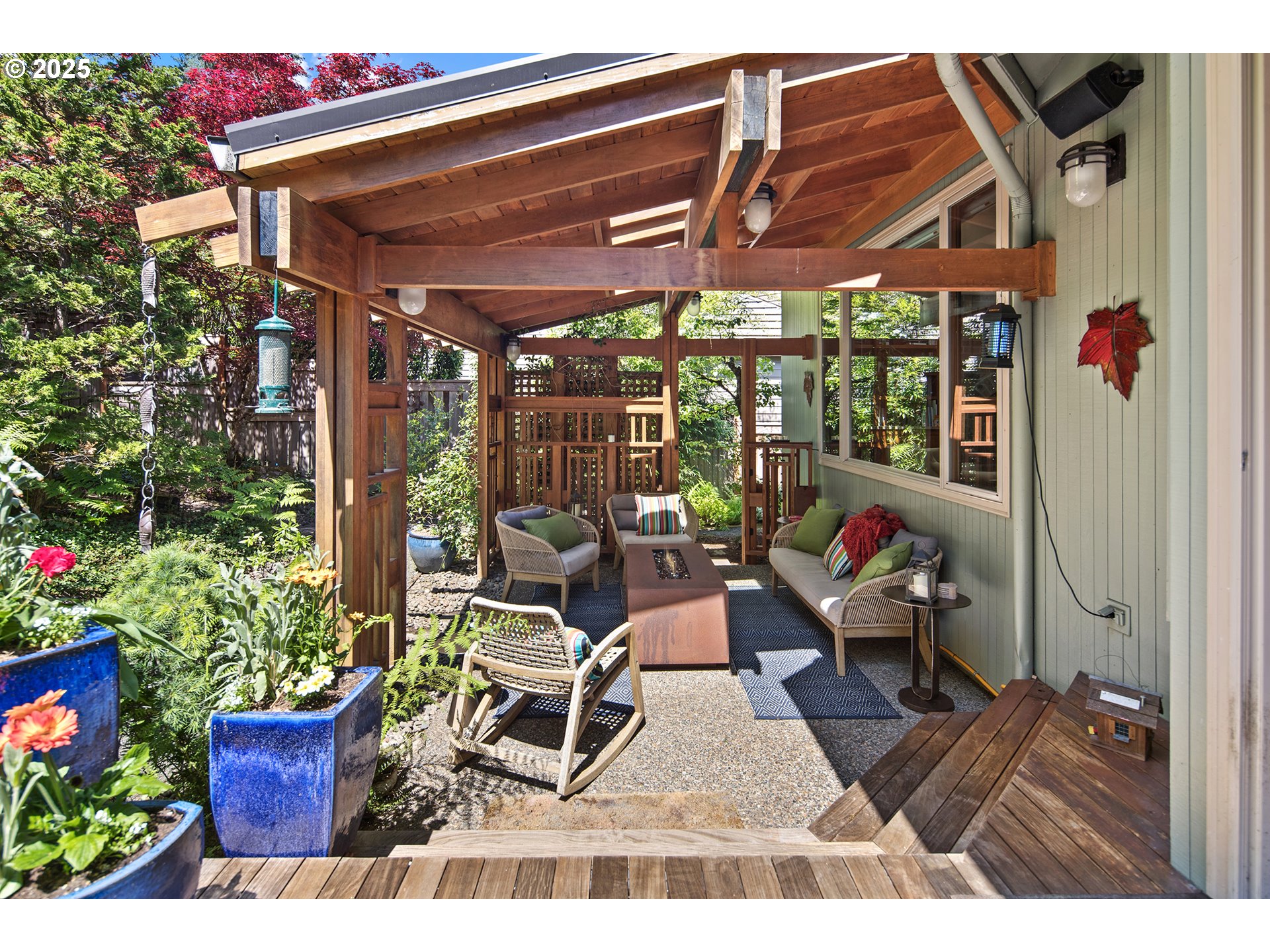 17514 Brookhurst Drive Lake Oswego, OR 97034 - Photo 37 of 37 a patio with table and chairs and potted plants