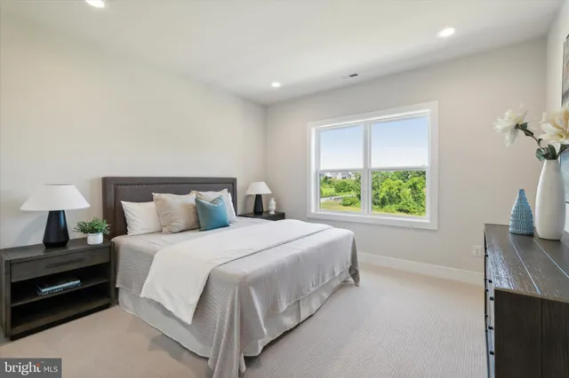 a bedroom with a bed and a tv