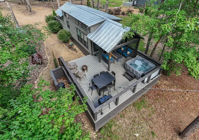 an aerial view of a house with roof deck