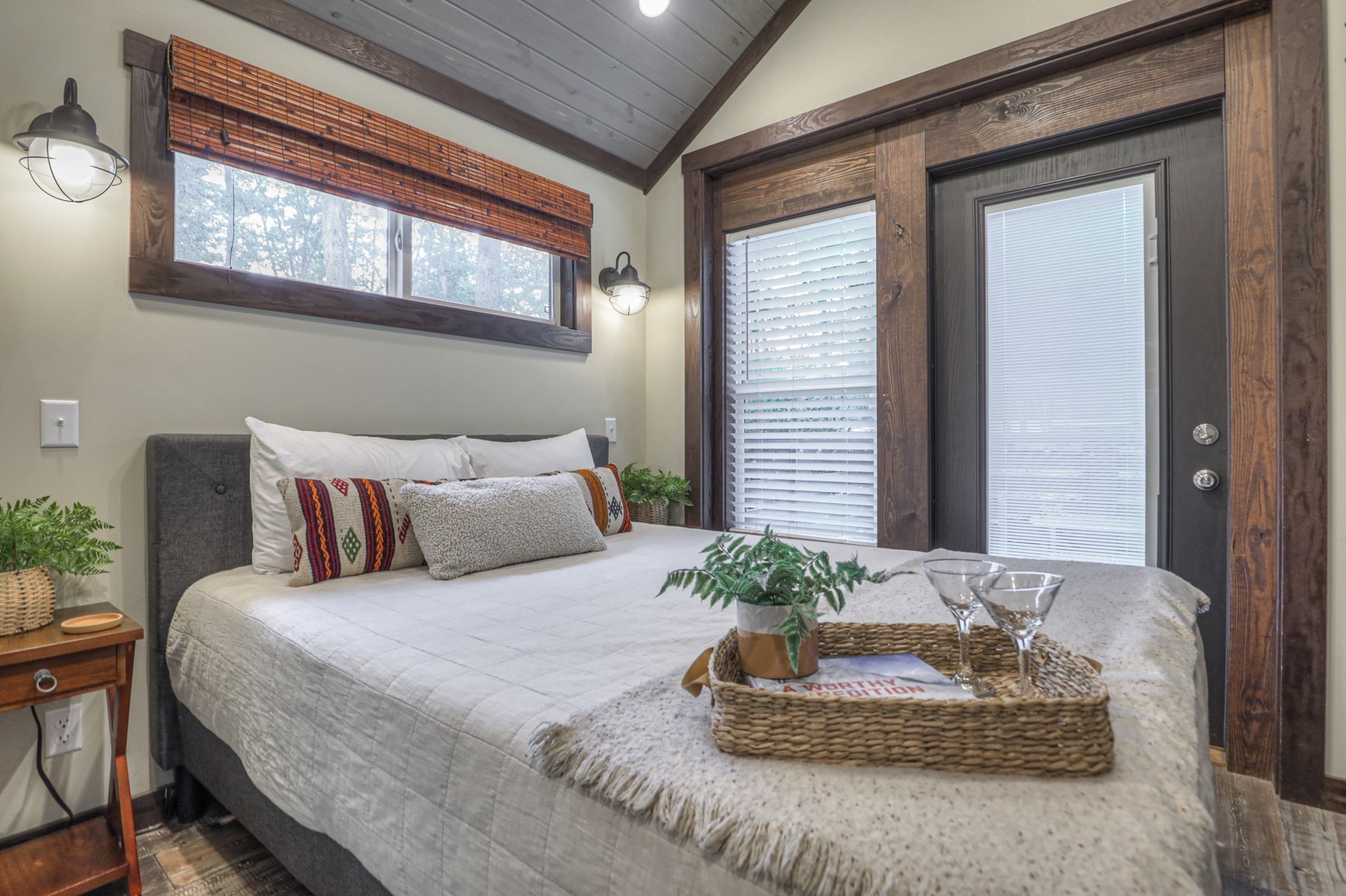 574 Deer Lick Trail Monteagle, TN 37356 - Photo 11 of 21 a bedroom with a large bed and a potted plant