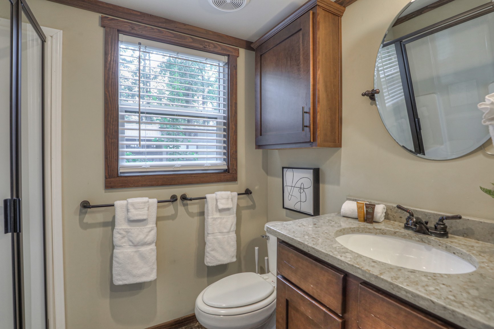 574 Deer Lick Trail Monteagle, TN 37356 - Photo 14 of 21 a bathroom with a granite countertop toilet sink and mirror