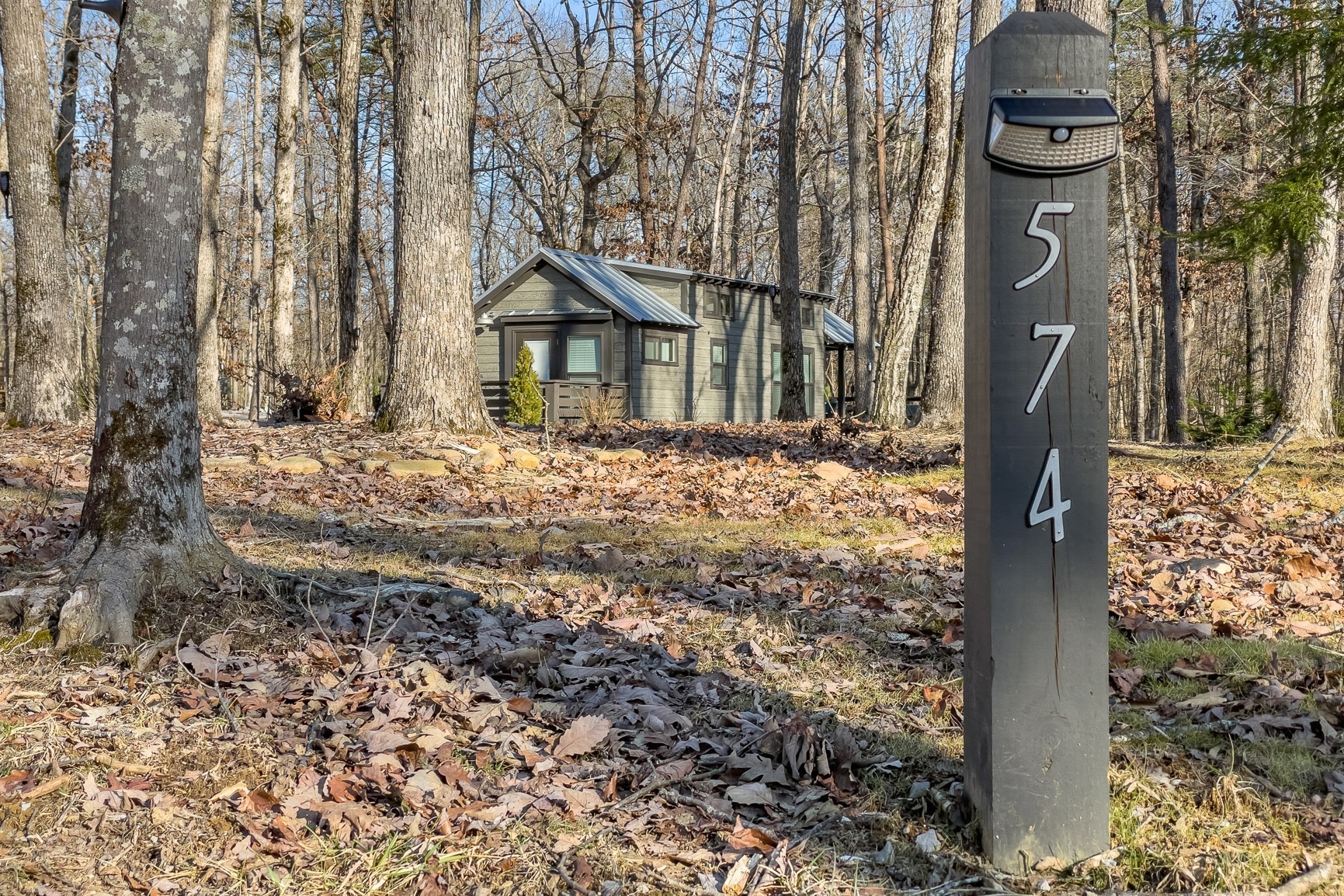 574 Deer Lick Trail Monteagle, TN 37356 - Photo 3 of 21 a front view of a house with a yard