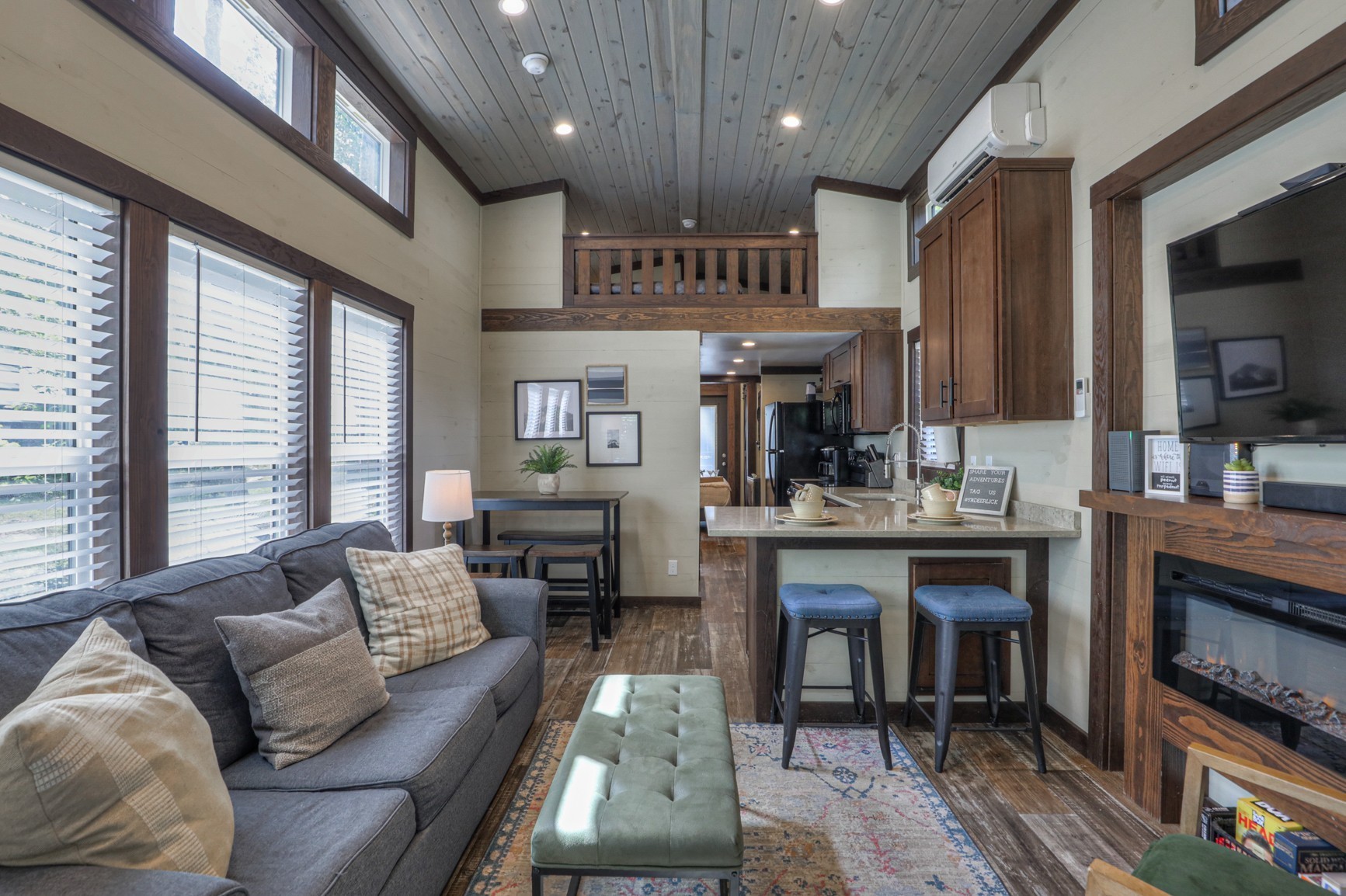 574 Deer Lick Trail Monteagle, TN 37356 - Photo 7 of 21 a living room with stainless steel appliances kitchen island granite countertop furniture and a fireplace