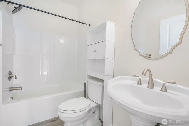 a bathroom with a sink toilet and a bathtub