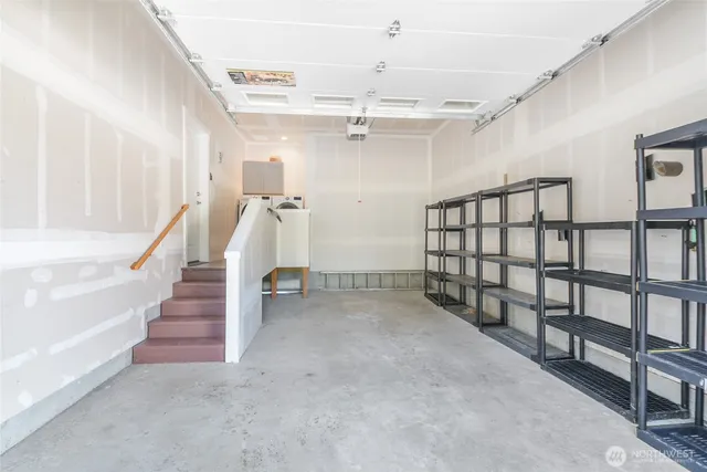 a view of a house with backyard and a tree