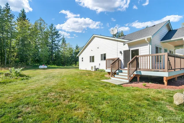 a view of house with yard