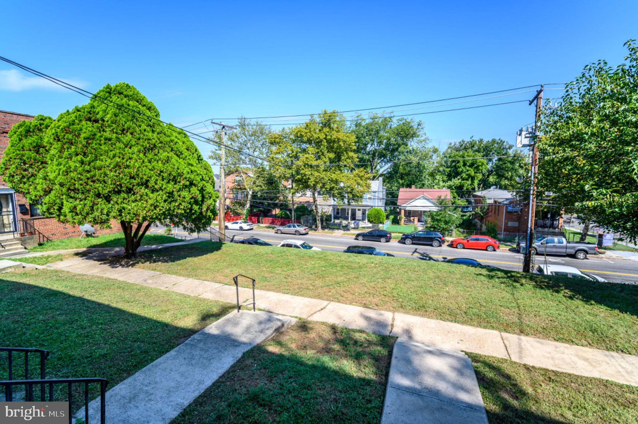 5053 Sheriff Road Northeast Washington, DC 20019 - Photo 26 of 32 Charming view of a vibrant street scene.