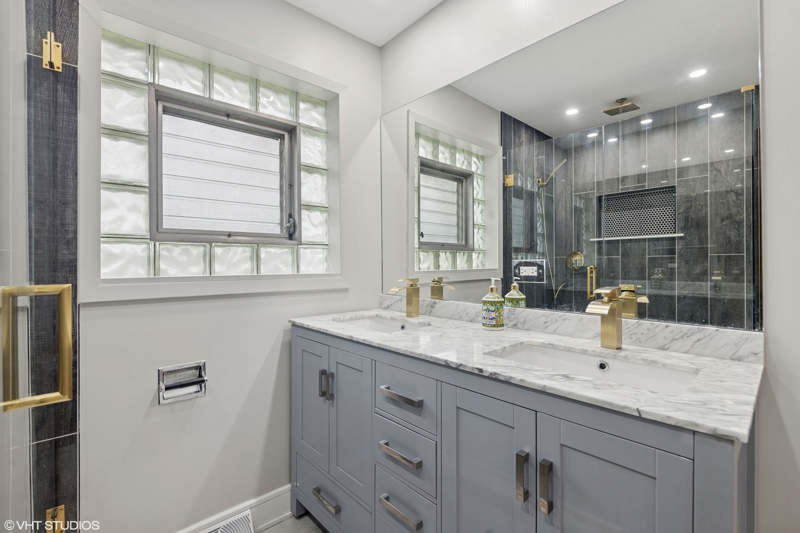 932 60th Place Downers Grove, IL 60516 - Photo 11 of 25 a bathroom with sinks double vanity and a mirror