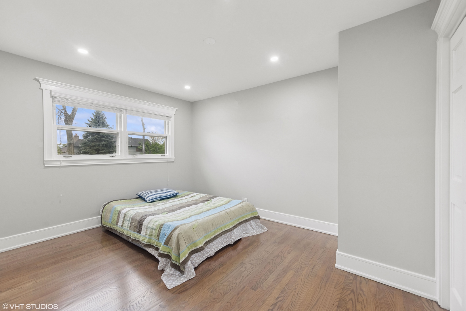 932 60th Place Downers Grove, IL 60516 - Photo 12 of 25 a bedroom with a bed and a window