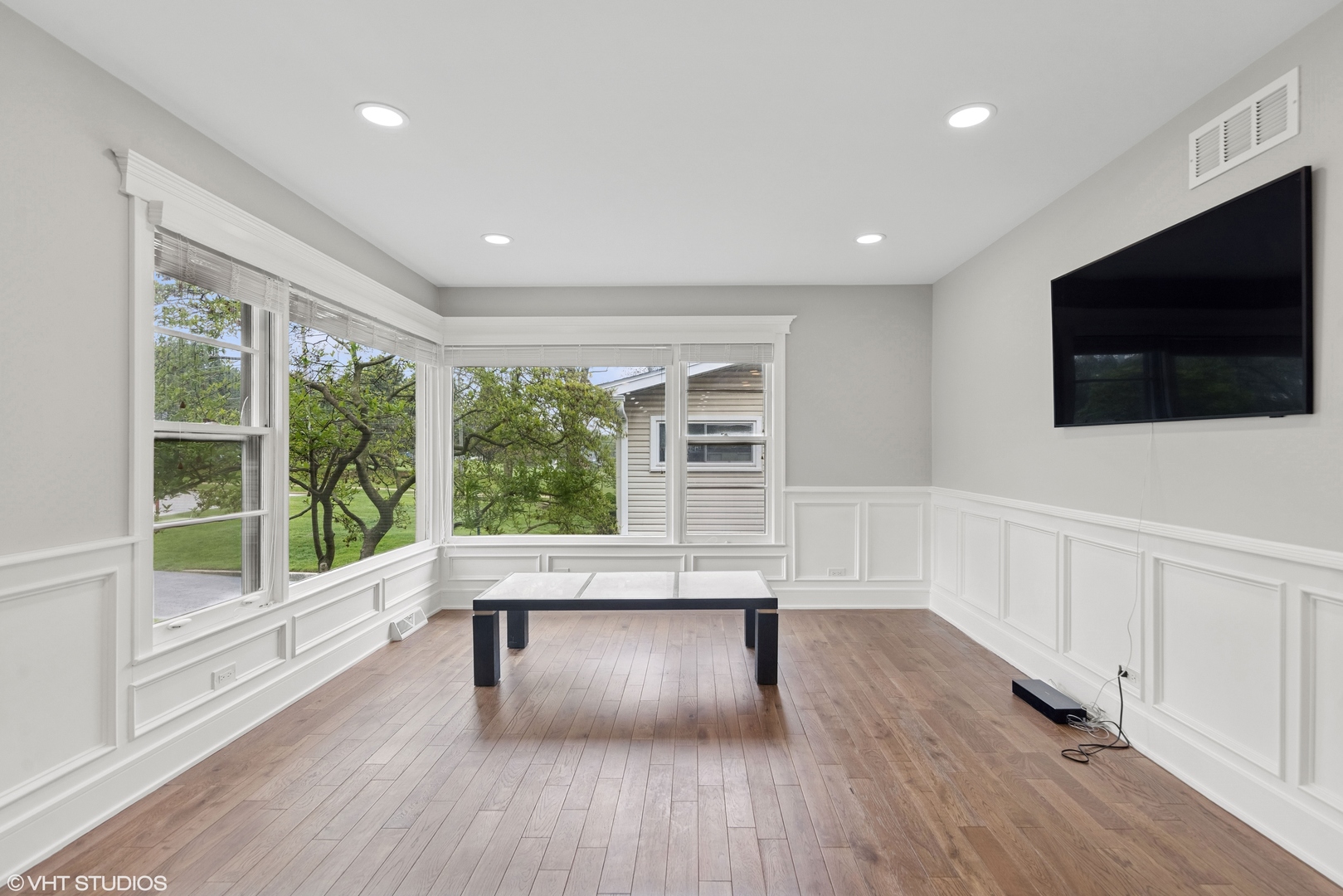 932 60th Place Downers Grove, IL 60516 - Photo 3 of 25 a living room with hardwood floor and a flat screen tv