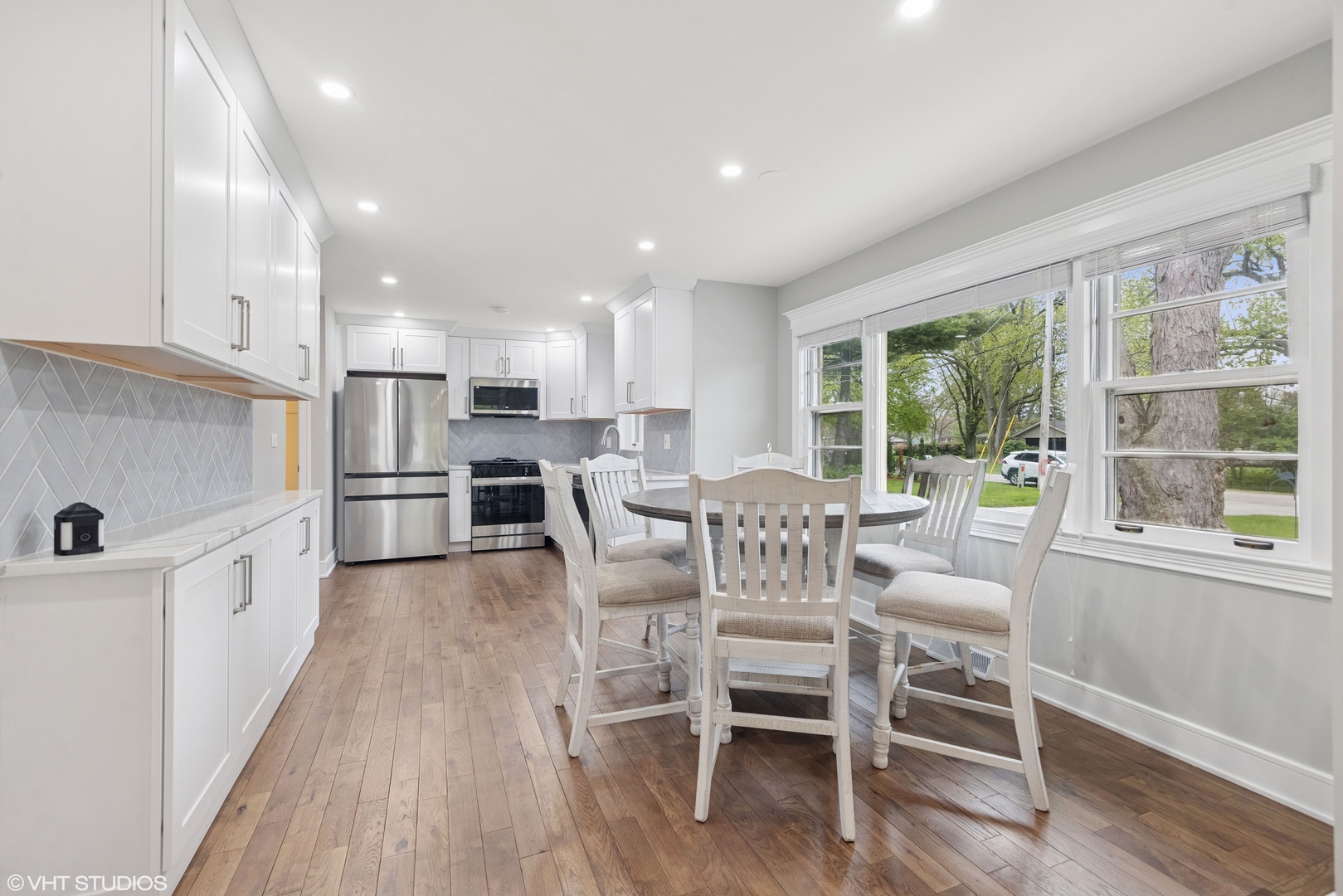 932 60th Place Downers Grove, IL 60516 - Photo 7 of 25 a view of a dining room with furniture window and wooden floor