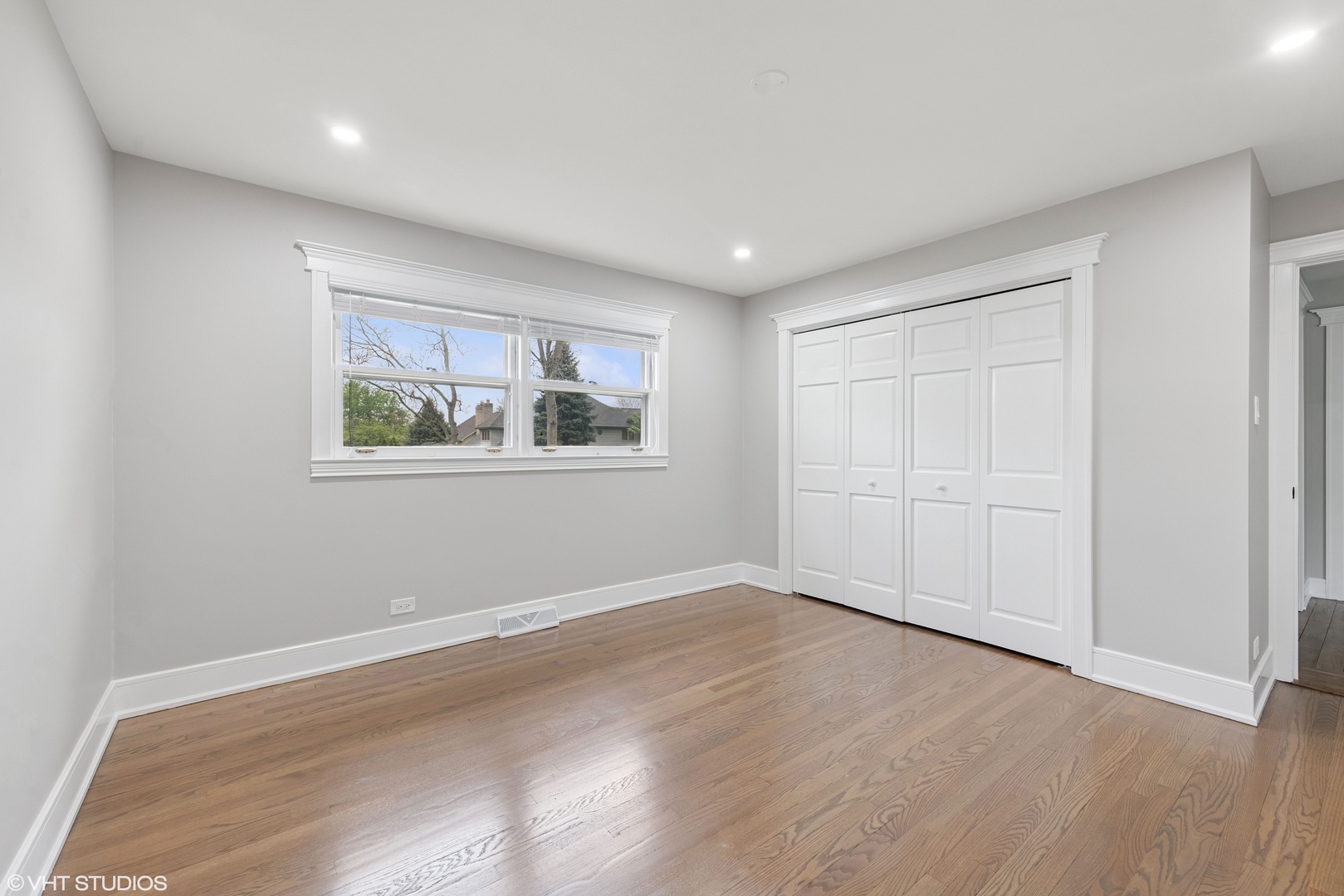932 60th Place Downers Grove, IL 60516 - Photo 9 of 25 wooden floor in an empty room with a window