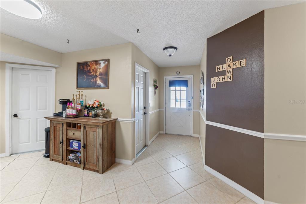 8715 Huntsman Lane Port Richey, FL 34668 - Photo 6 of 54 a kitchen with stainless steel appliances granite countertop a refrigerator and a sink