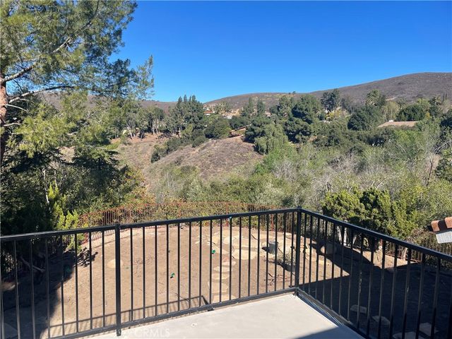 a balcony with an outdoor space