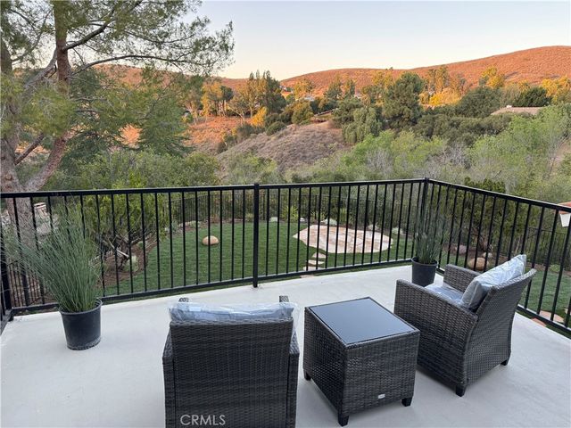 a view of a balcony with couches