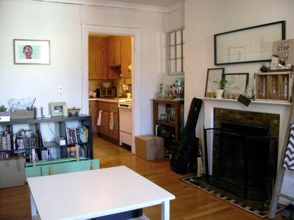 924 Beacon Street, Unit 6 Boston, MA 02215 - Photo 7 of 28 a living room with furniture a fireplace and next to a window