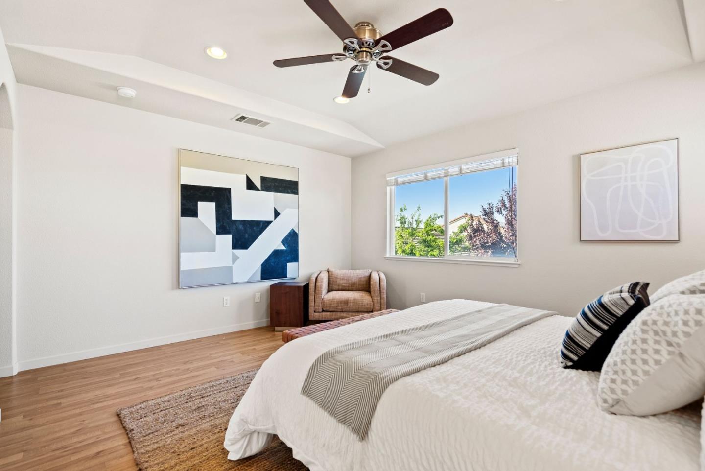 4863 Greencastle Way Antioch, CA 94531 - Photo 31 of 52 a bedroom with a bed and a chandelier