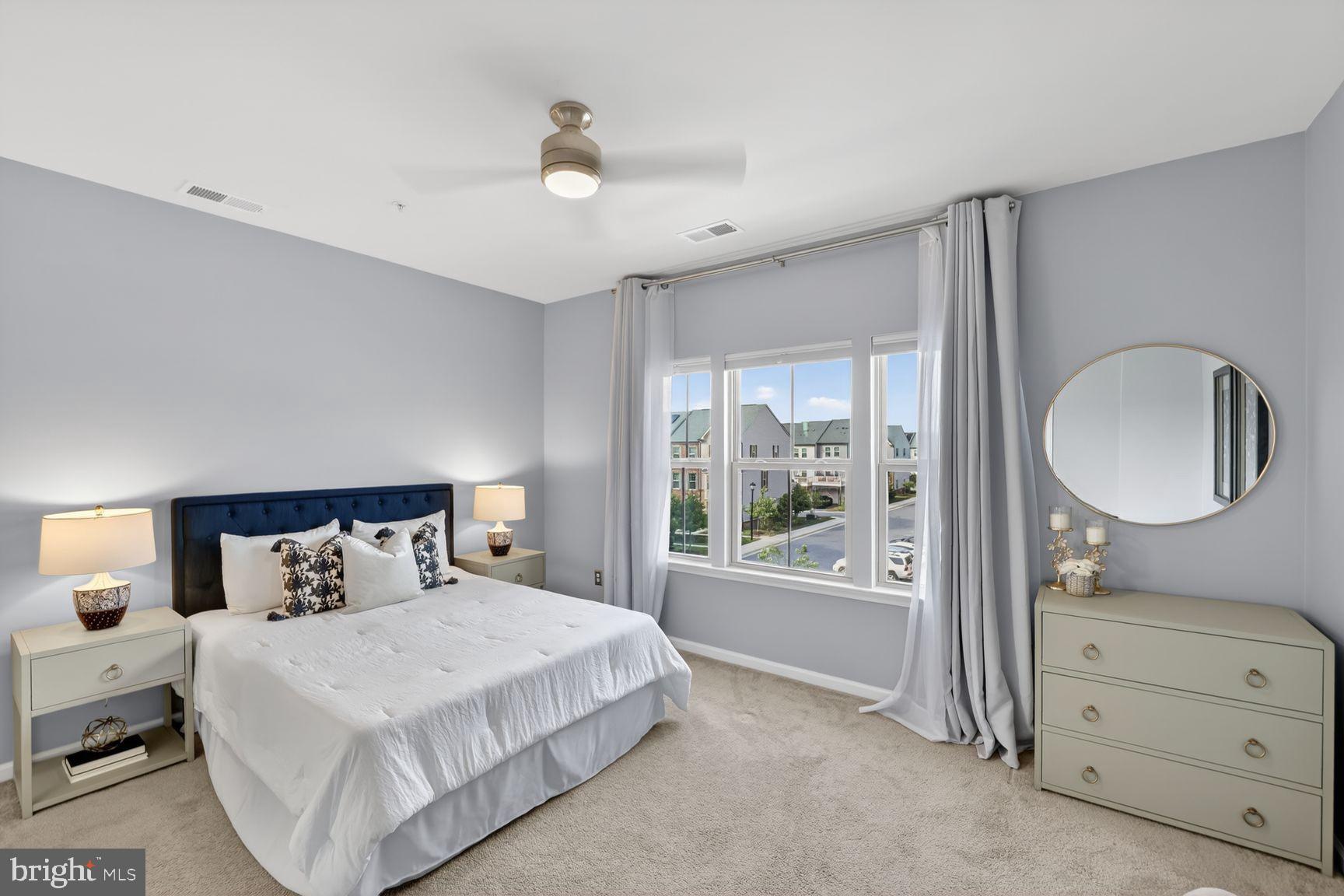 3111 Potters Hill Road Hanover, MD 21076 - Photo 15 of 40 a bedroom with a large bed and a dresser