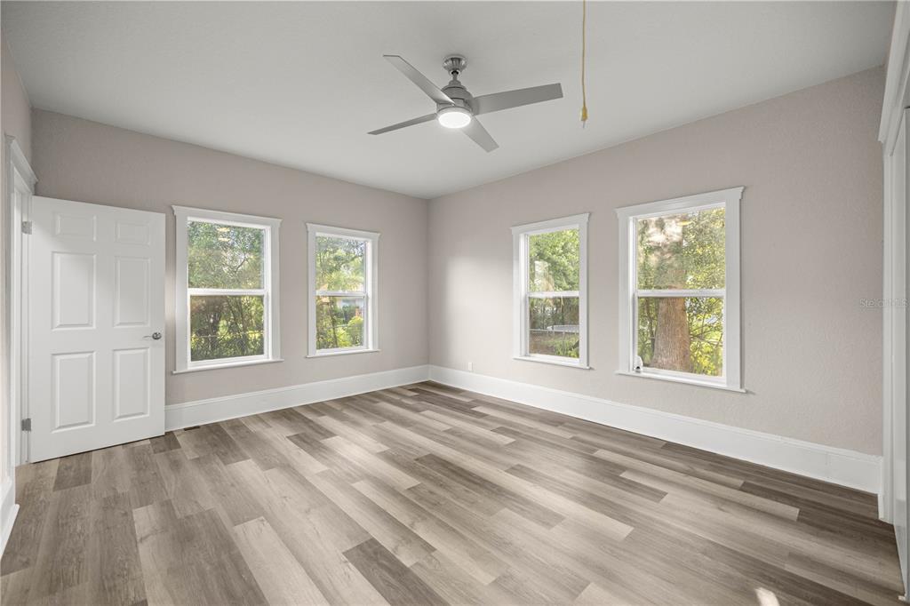 4609 Northeast 7th Street Ocala, FL 34470 - Photo 26 of 36 a view of an empty room with a window and a kitchen area