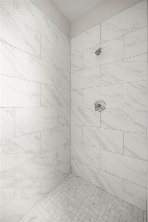 4609 Northeast 7th Street Ocala, FL 34470 - Photo 29 of 36 a bathroom with a shower