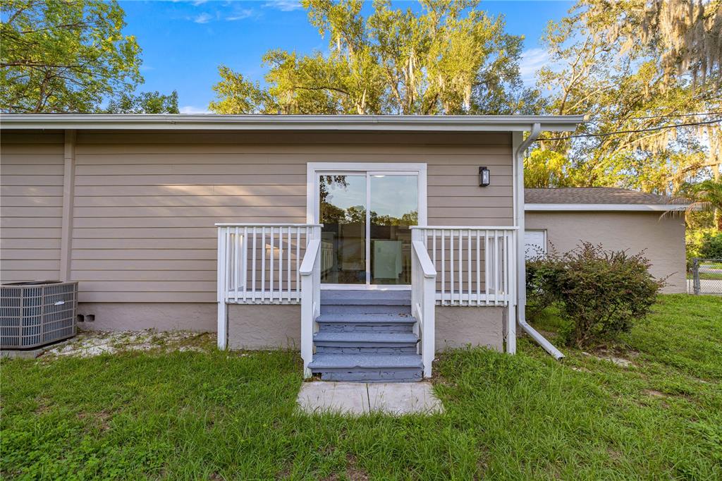 4609 Northeast 7th Street Ocala, FL 34470 - Photo 32 of 36 a front view of a house with garden