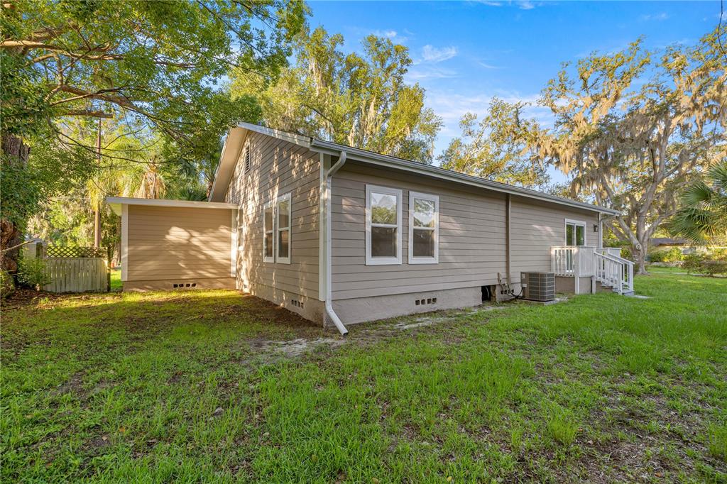 4609 Northeast 7th Street Ocala, FL 34470 - Photo 33 of 36 a backyard of a house with lots of green space