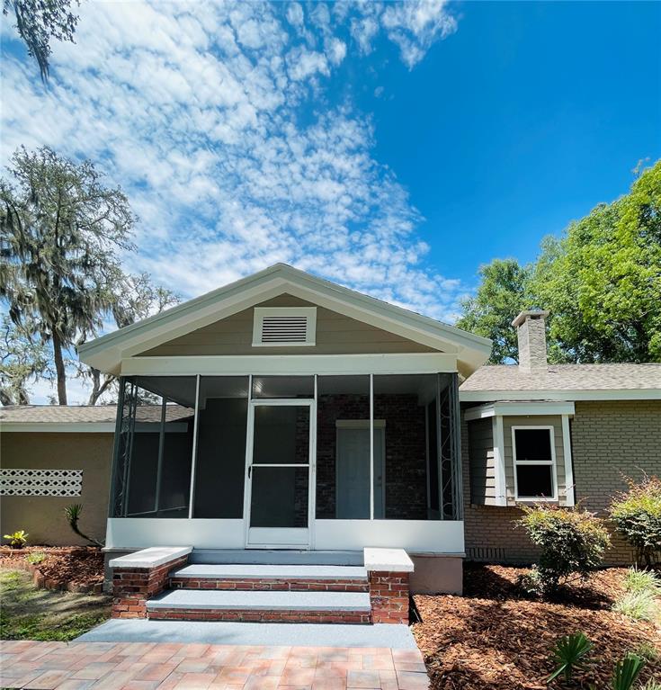 4609 Northeast 7th Street Ocala, FL 34470 - Photo 5 of 36 a front view of a house with a yard