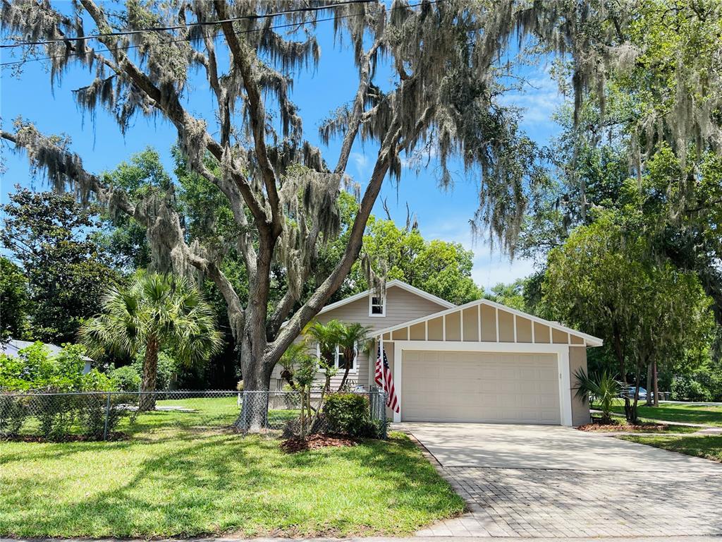4609 Northeast 7th Street Ocala, FL 34470 - Photo 7 of 36 a front view of house with yard and green space