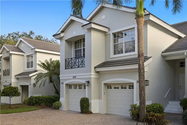 a front view of a house with a garage