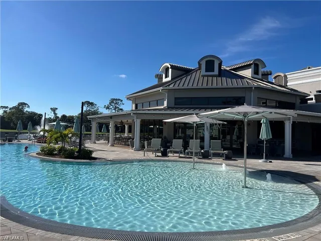 a view of a patio with swimming pool