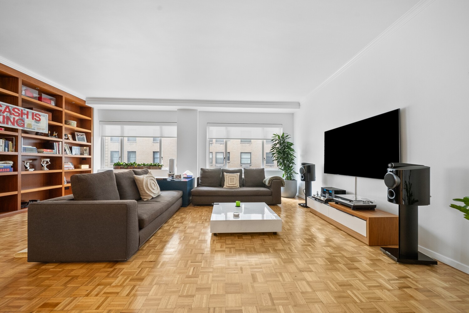 475 Park Avenue, Unit 8D Manhattan, NY 10022 - Photo 1 of 9 a living room with furniture and a flat screen tv