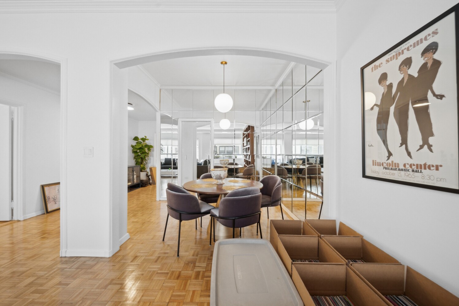 475 Park Avenue, Unit 8D Manhattan, NY 10022 - Photo 3 of 9 a view of a dining room with furniture and a potted plant