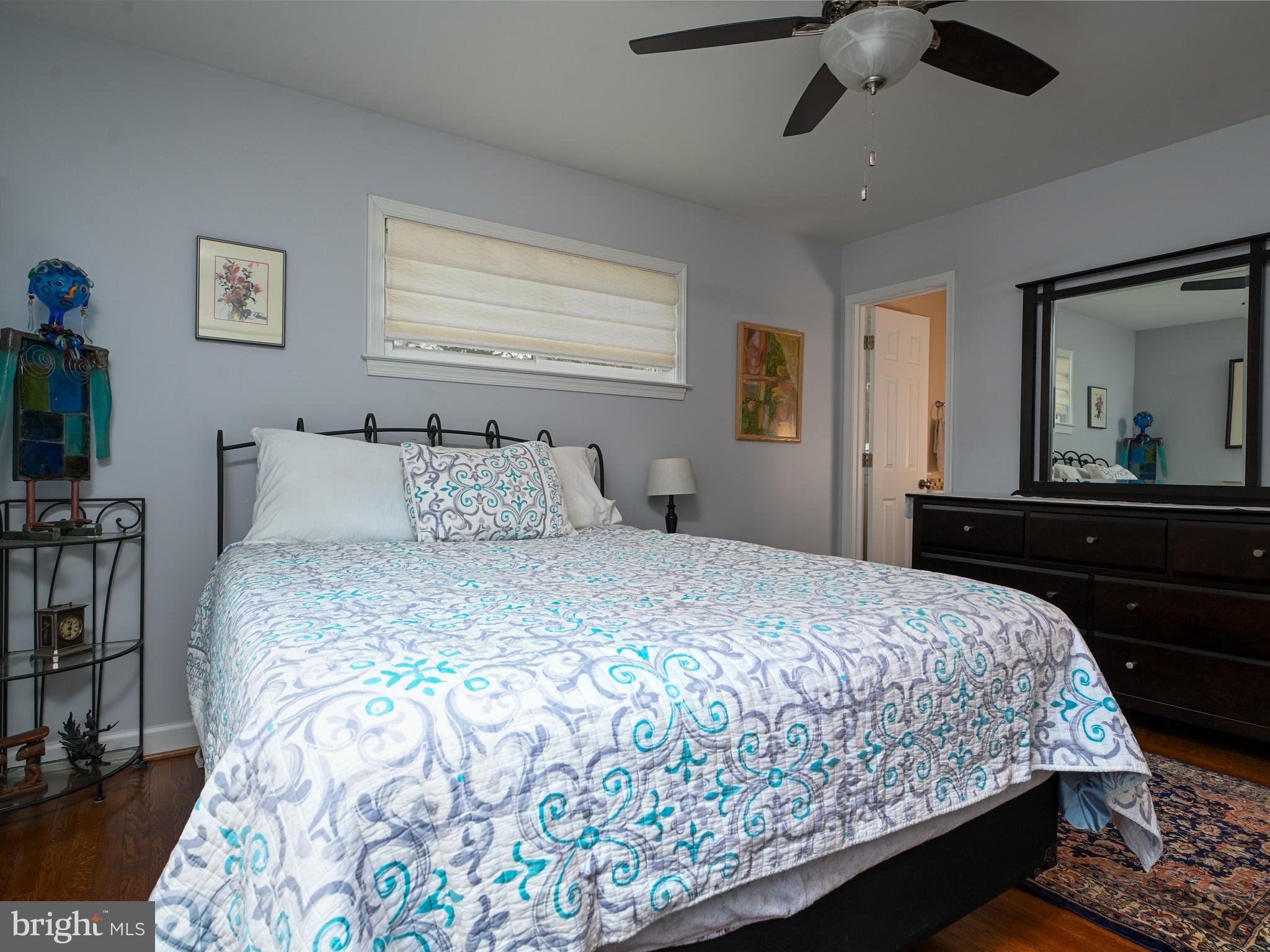 7951 Jansen Drive Springfield, VA 22152 - Photo 14 of 36 a bedroom with a bed and a dresser