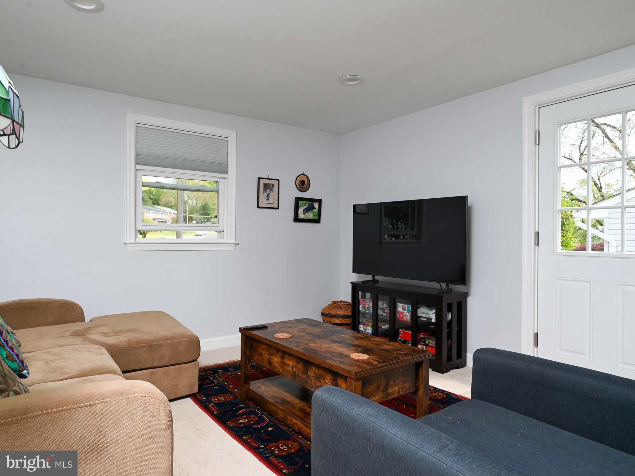 7951 Jansen Drive Springfield, VA 22152 - Photo 21 of 36 a living room with furniture and a flat screen tv