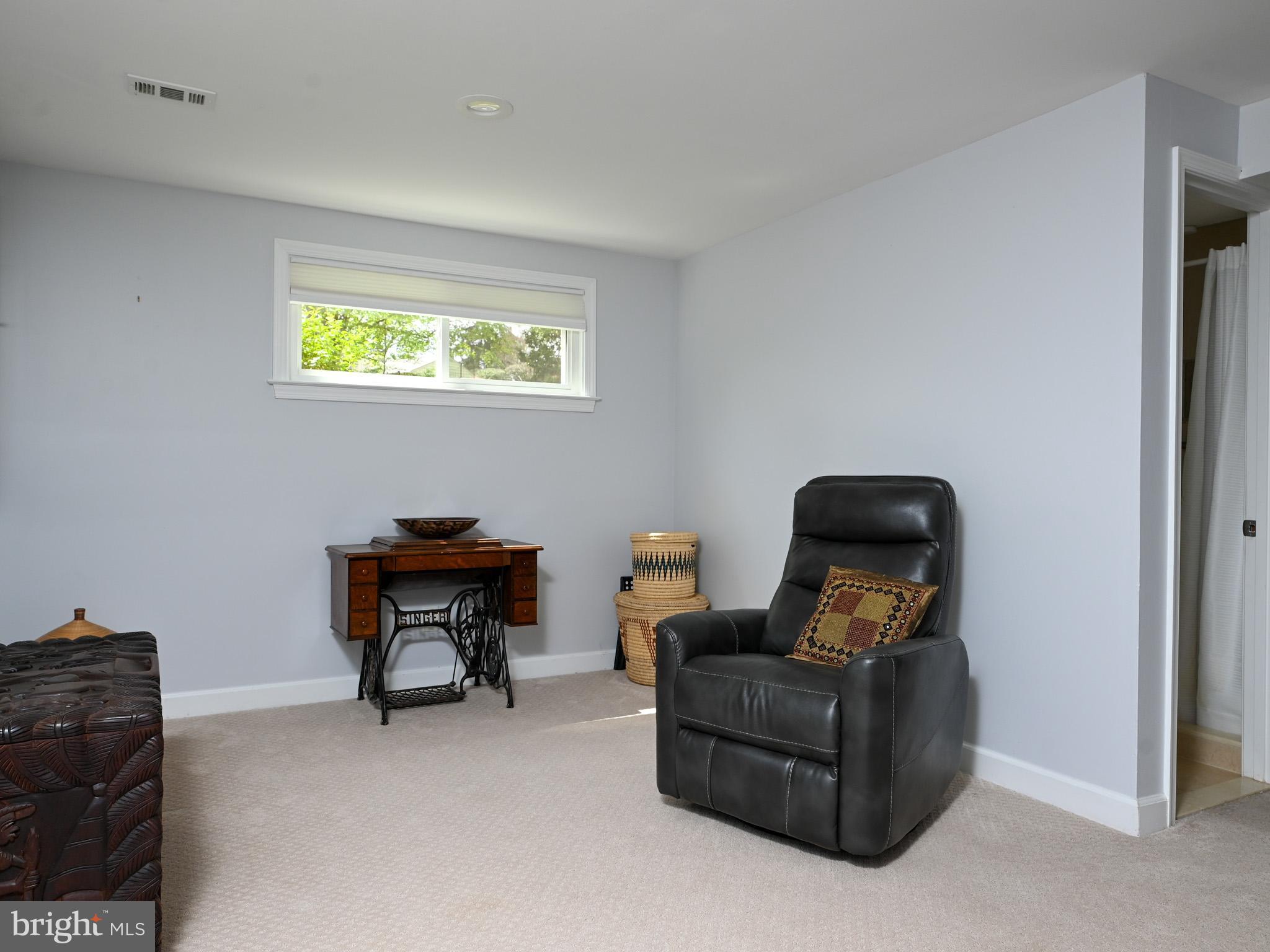 7951 Jansen Drive Springfield, VA 22152 - Photo 25 of 36 a living room with furniture and a flat screen tv