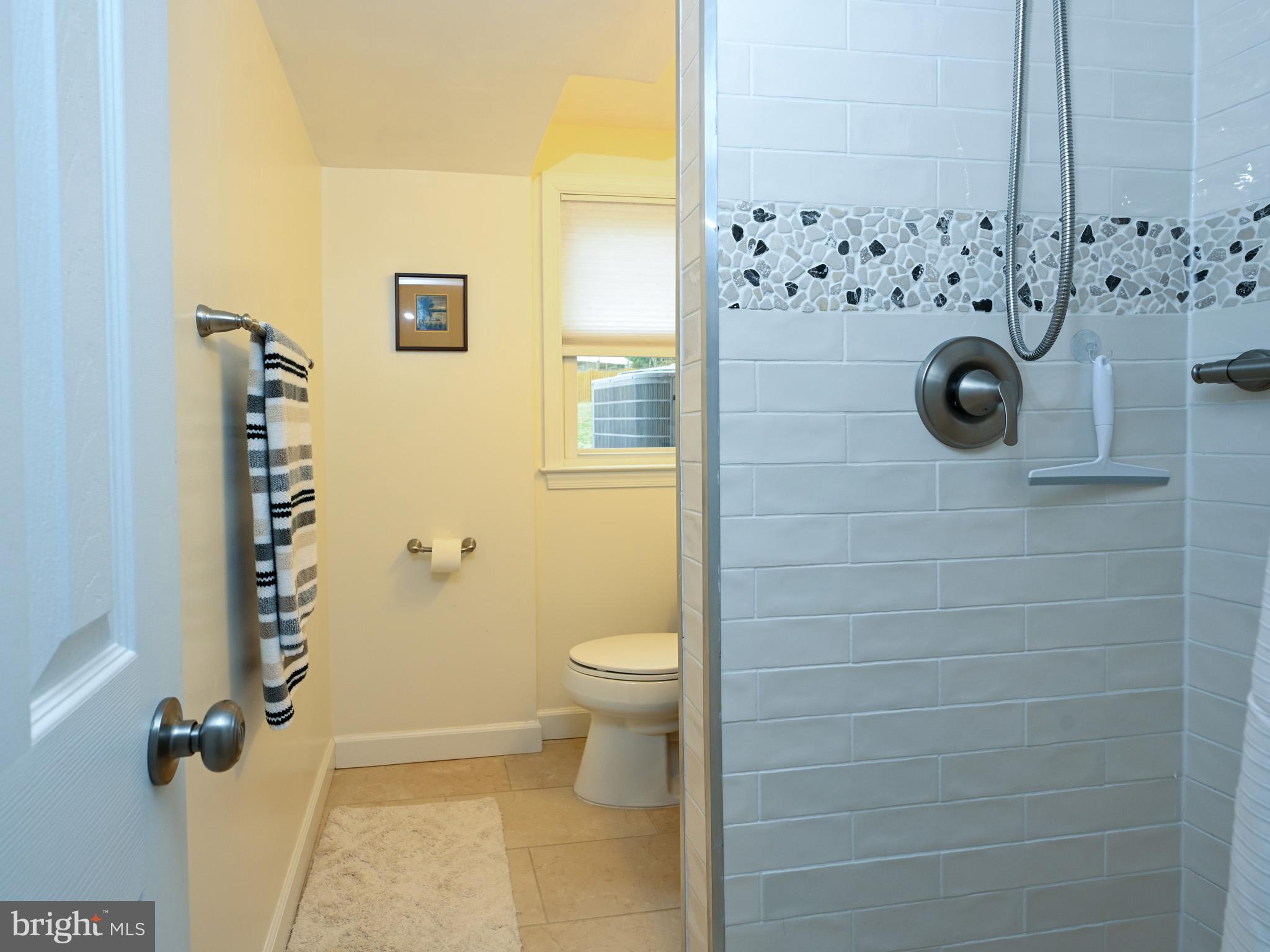 7951 Jansen Drive Springfield, VA 22152 - Photo 29 of 36 a bathroom with a toilet and a shower