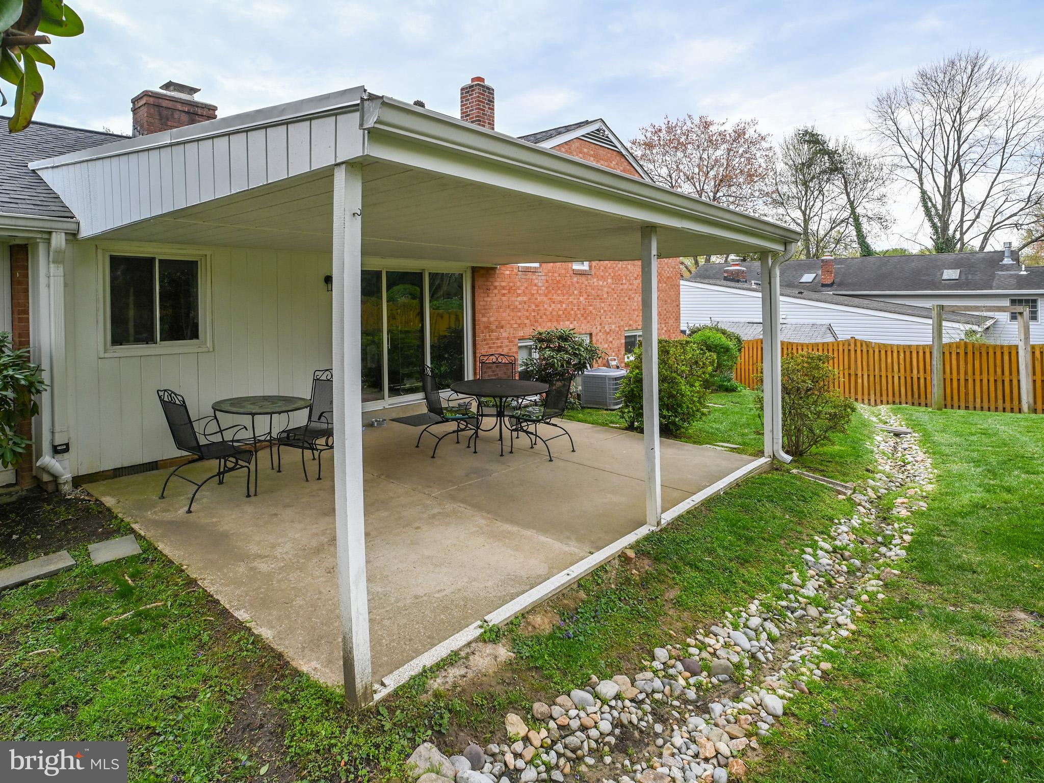 7951 Jansen Drive Springfield, VA 22152 - Photo 30 of 36 a view of a house with backyard porch and sitting area